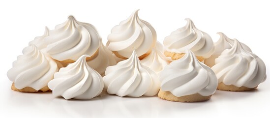 A line of white meringue cookies is beautifully displayed on a white platter, creating a lovely contrast. This elegant and light dessert is perfect for any occasion
