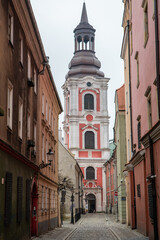 Fototapeta na wymiar Polish Street and Basilica of Our Lady of Perpetual Help, Mary Magdalene and St. Stanislaus, Poznan Poland