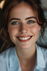 A woman with a smile on her face, perfect for various projects