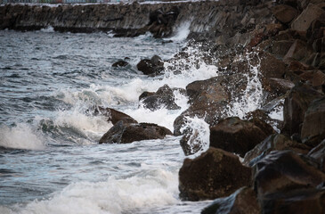 Waves crashing against a rocky shoreline on Puget Sound near Seattle Washington