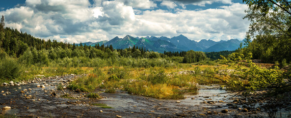 Tatra Mountains, Poland. Panorama of a mountain landscape. Panoramic photo of a mountains and river. Late summer mountain view