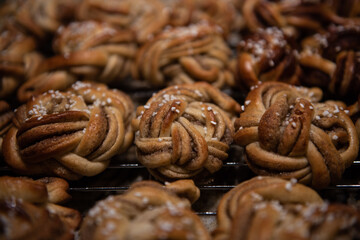 Braided Kardemummabullar, swedish pastries for fika or cardamom rolls, freshly baked and covered in pearl sugar