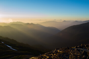 Sunset shining through the foothills see from the flanks of Mount Baker in the cascades © Jacob Hall
