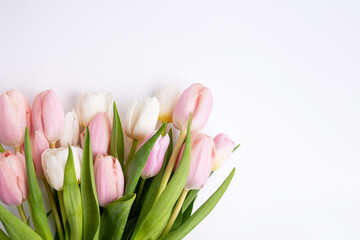 Beautiful bouquet of tulips on a light background. Place for text. Flower card