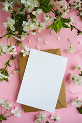 postcard mockup. spring flowers. flowering branches on a white background, envelope and white blank...