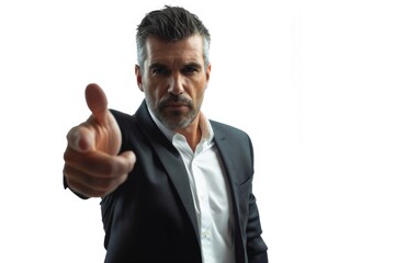 A man in a suit pointing at the camera. Suitable for business concepts