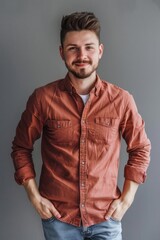 Fototapeta premium A man standing with his hands in his pockets. Suitable for business or casual concepts