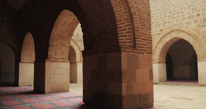 Interior view of the Harput Ulu Mosque building. Symmetrical stance of brick arches with stone foundations. Harput Ulu Mosque is located in today's Elazığ province.