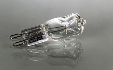 One light bulb on a gray background close-up