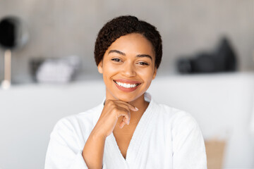 Radiant young black woman with beautiful skin smiling at camera - Powered by Adobe