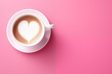 Top view of a freshly brewed cappucino with a perfect heart-shaped latte art on a white cup, set against a soft pink background.
 - obrazy, fototapety, plakaty