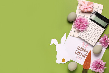 Composition with greeting card, stationery and Easter decor on green background