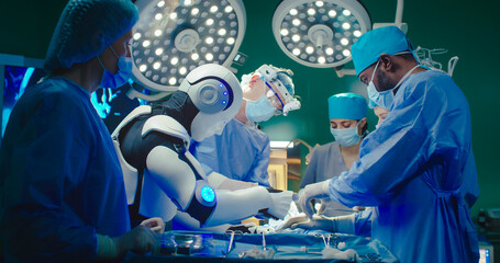 Robot and multiracial team of professional medical surgeons performs surgical operation in modern hospital. Doctors are working to save patient. Concept of future robotic surgery. - obrazy, fototapety, plakaty