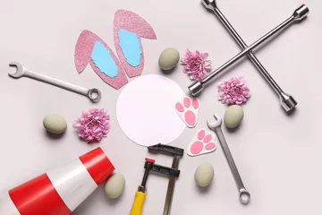 Foto op Aluminium Composition with blank card, tools for car repair and Easter eggs on light background © Pixel-Shot
