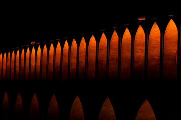 Siosehpol or the bridge of 33 arches, a  historical brick bridge in Esfahan, Iran at night with...