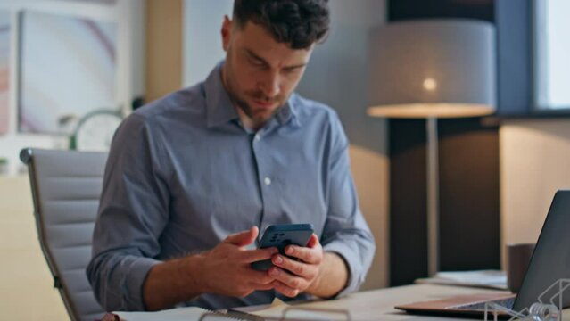 Focused businessman receiving notification at laptop table workplace closeup