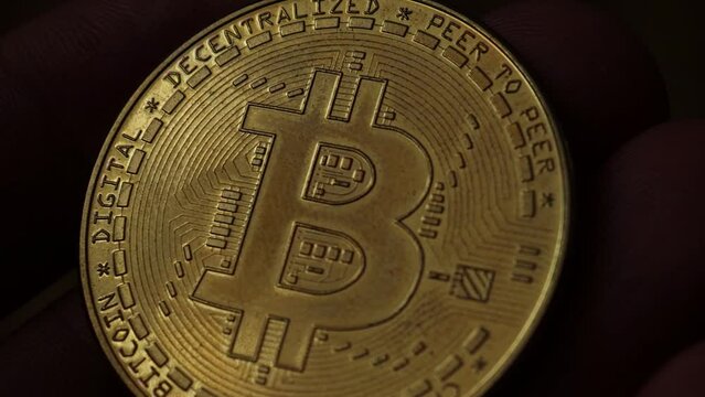 Bitcoin cryptocurrency motion shot. Crypto currency, bitcoin mining. Macro shot of bitcoins