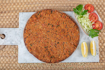 Lahmacun from buckwheat flour. Turkish dishes: lahmacun, turkish pizzas, lemon, parsley. Healthy...