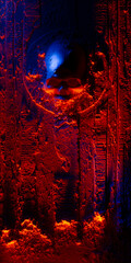 Skull illuminated with blue and red lights on a textured wood