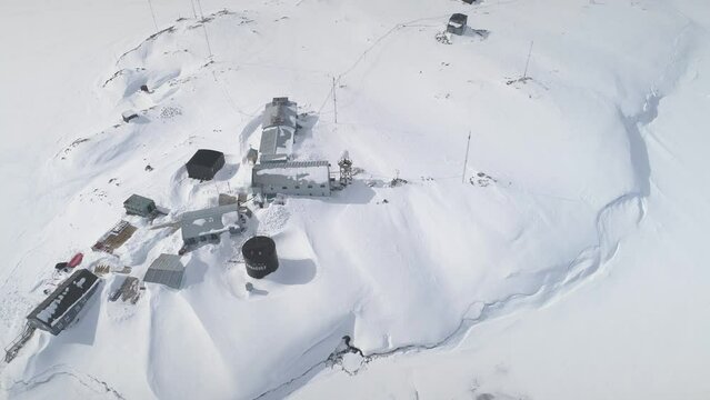 Antarctica Vernadsky Polar Station Aerial View. Antarctic Spring Nature Wildlife Top Drone Flight Shot. Pole Animal Crabeater Seal Gull at Ocean Bay Base. Climate Change Research Concept Footage 4K
