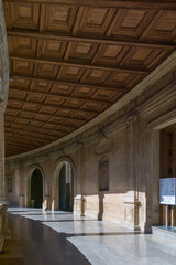 Walkway around the courtyard in Palacio de Carlos V with marble and wooden ceiling at Alhambra,...