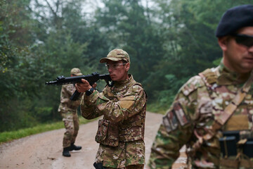 A disciplined and specialized military unit, donned in camouflage, strategically patrolling and...