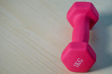 Pink 1kg dumbbells. Weights for a fitness training.