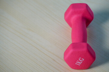 Pink 1kg dumbbells. Weights for a fitness training.