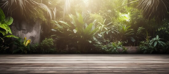 Old wooden plank wall background with concrete floor and sunlight entering from tropical garden behind.