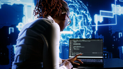 AI cloud computing business executive programming scripts for AI machine learning. Hardworking...