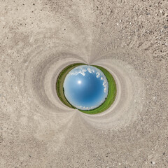 blue hole sphere little planet inside sand round frame background