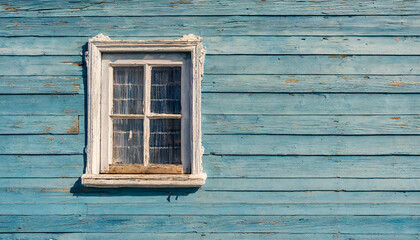 Textured blue wooden wall showing signs of weathering, with a single rustic window