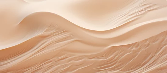 Fotobehang A close up of a sand dune in the desert reveals intricate patterns of brown, amber, and peachcolored sand grains, shaped by the wind on this aeolian landform © 2rogan
