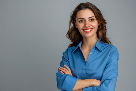 Happy young smiling confident professional business woman wearing blue shirt