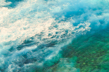 Fototapeta na wymiar Aerial view ocean with waves background. Marine background texture of blue sea in Indian Ocean. Copy space. Horizontal shot.