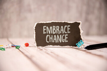wooden blocks with letters making Embrace Change text.