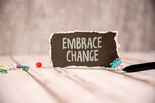 wooden blocks with letters making Embrace Change text.