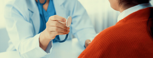 Patient attend doctor's appointment at clinic or hospital office. Doctor examining and diagnosis...
