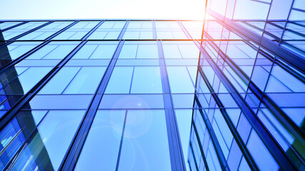 Modern office building with glass facade. Transparent glass wall of office building. Reflection of...
