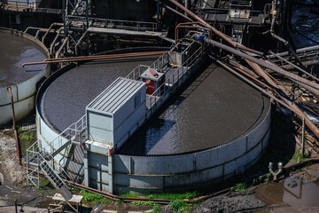 Round flotation basin at ore dressing plant, aerial view