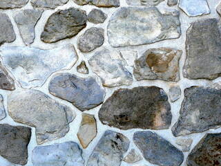 Antique brick wall texture. Irregular colorful stone pattern. 