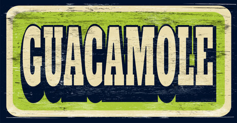 Aged and worn guacamole sign on wood