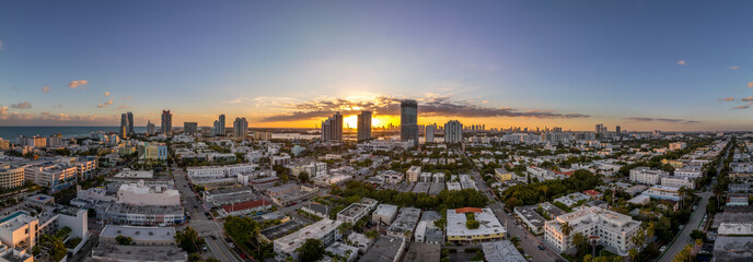 Aerial sunset over Miami South Beach with luxury residential buildings, Art Nuevo houses