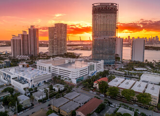Aerial sunset of Miami Beach luxury sky scraper condo complex with colorful sky