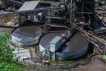 Round flotation basin at ore dressing plant, aerial view