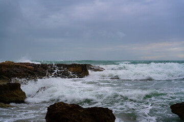 Rough sea with waves hitting the reef 4