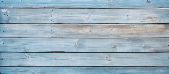 Detailed light blue old wooden wall texture with close-up of wood plank fence.