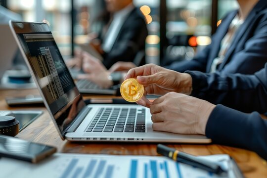 People showing bitcoin on laptop computer. Cryptocurrencies. Business graphic