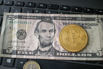 Bitcoin on a five dollar note