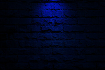 blue spot light on brick wall background